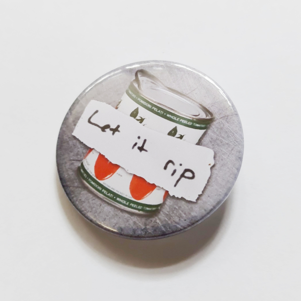 Round badge with silver background, can of tomatoes, "Let it Rip" banner