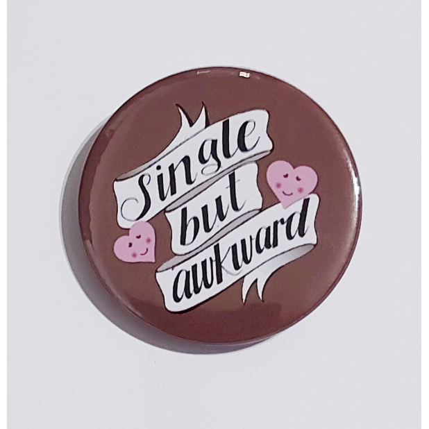 Badge with a brown background that reads "Single but awkward"